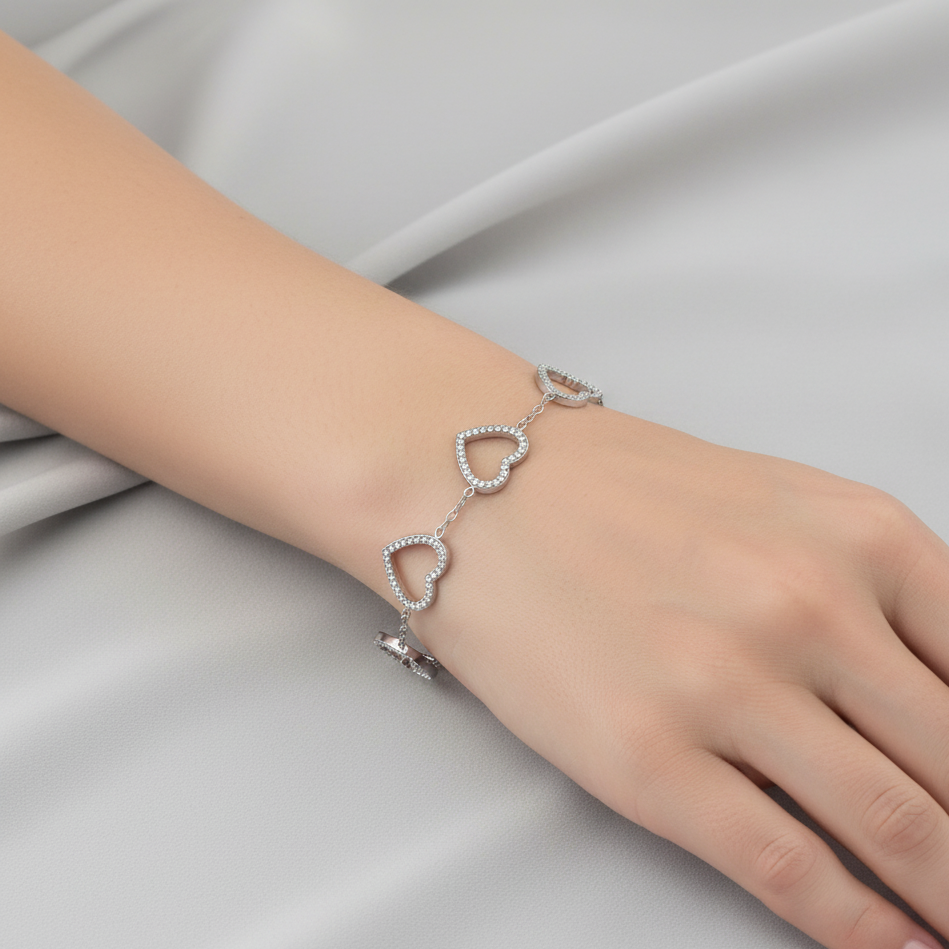 Bracciale con Cuori Contornati da Zirconi Luminosi in Acciaio Inossidabile