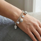 Bracciale Melodia d'Amore con Campanelle e Cuori in Acciaio Inossidabile